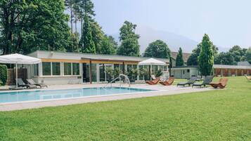 Seasonal outdoor pool, pool loungers