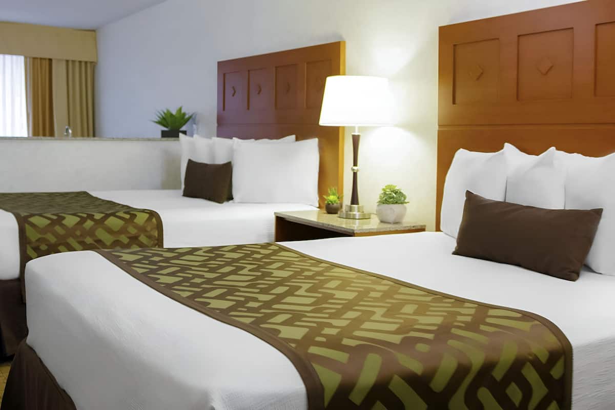 Deluxe Suite, 2 Queen Beds, Jetted Tub | 1 bedroom, in-room safe, desk, blackout curtains