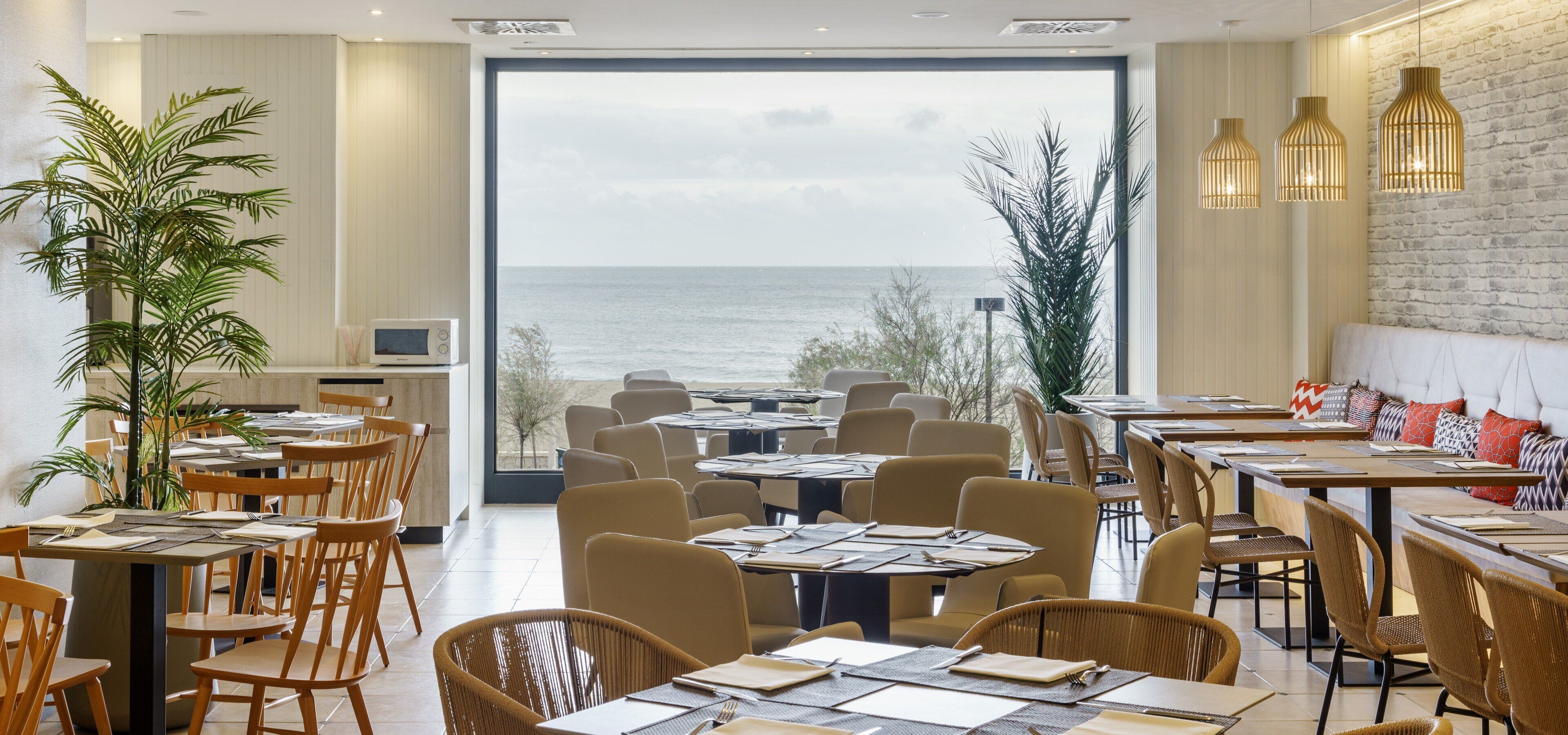 Breakfast, lunch, dinner served; beach views