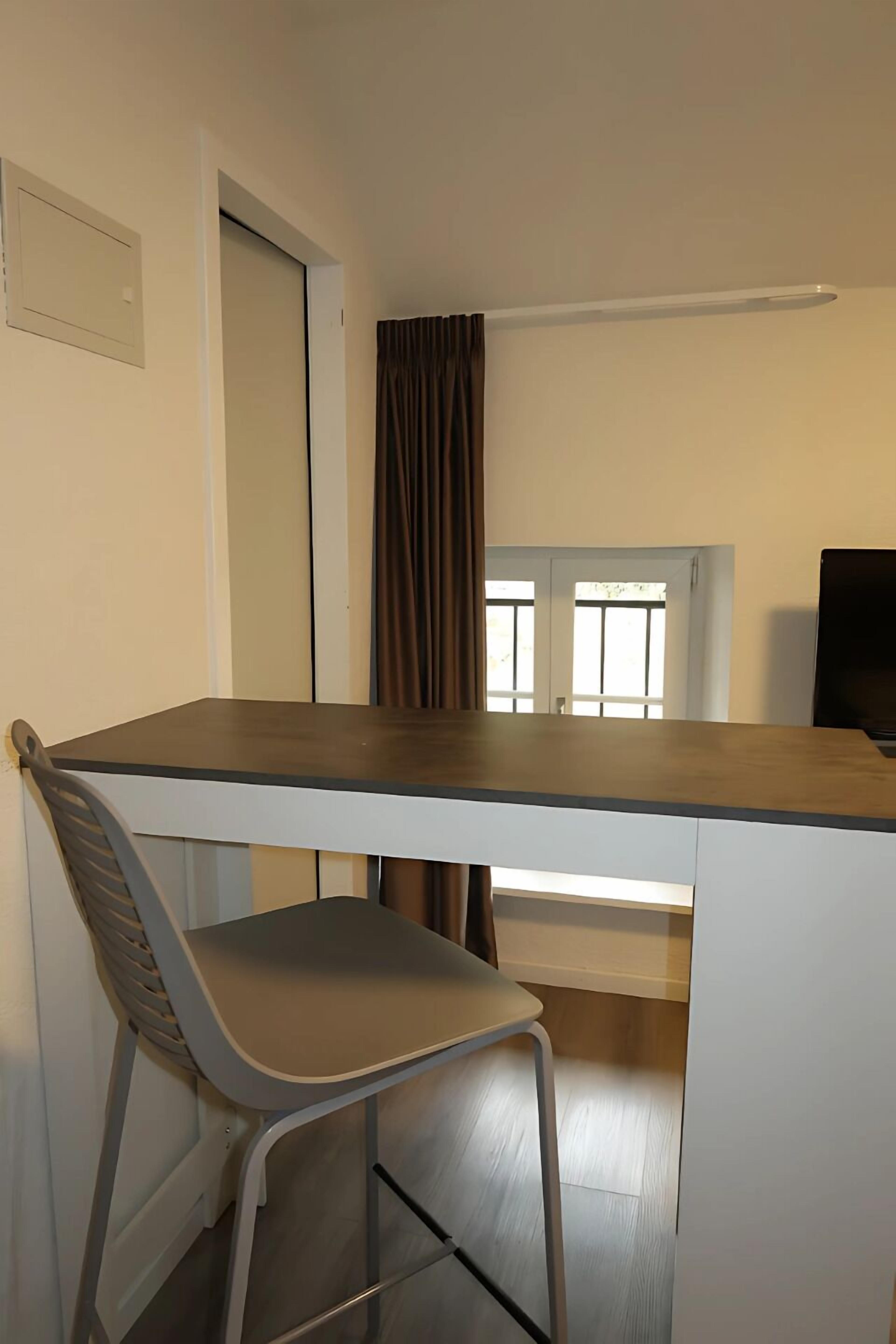 classic double room single use, 1 queen bed | living area | flat-screen tv