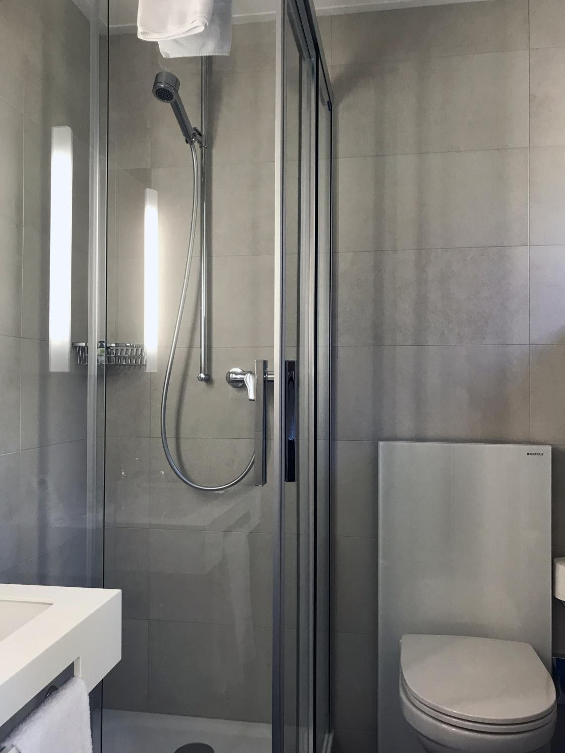 shower, free toiletries, hair dryer, towels