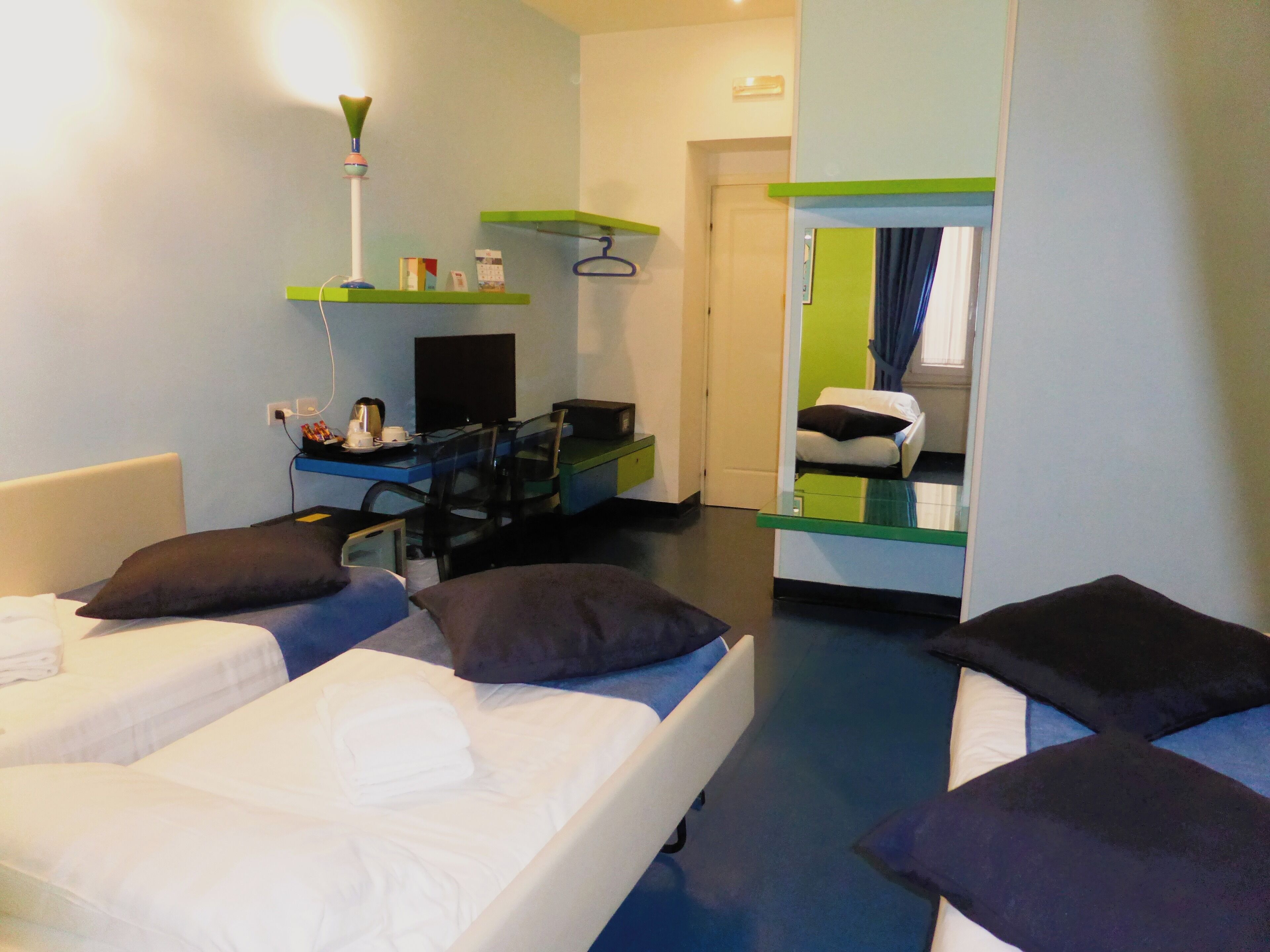 standard quadruple room | 1 bedroom, minibar, in-room safe, desk