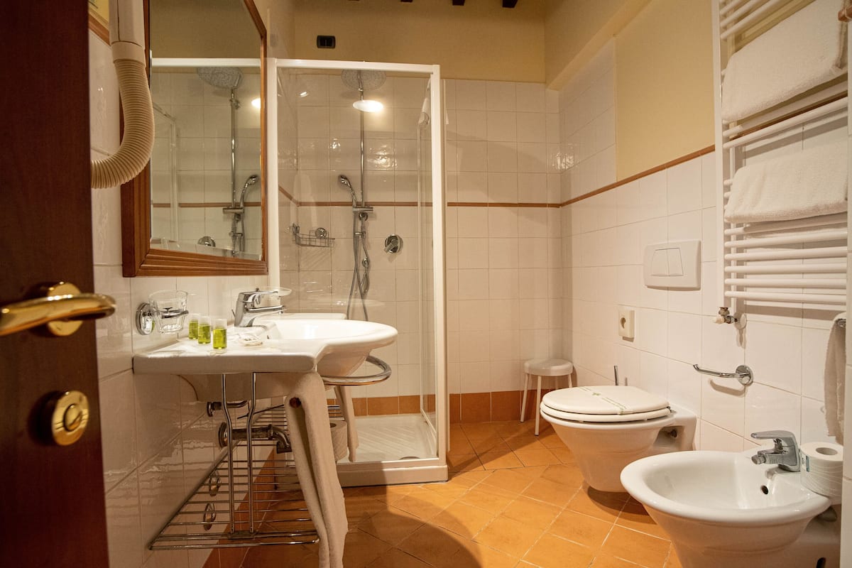 deluxe double room | bathroom | designer toiletries, hair dryer, bidet