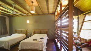 A room with two beds, a ceiling fan, and a hammock. - Heliconia Amazon River Lodge (Indiana)