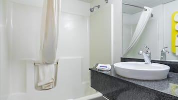 Combined shower/bathtub, towels, soap, shampoo