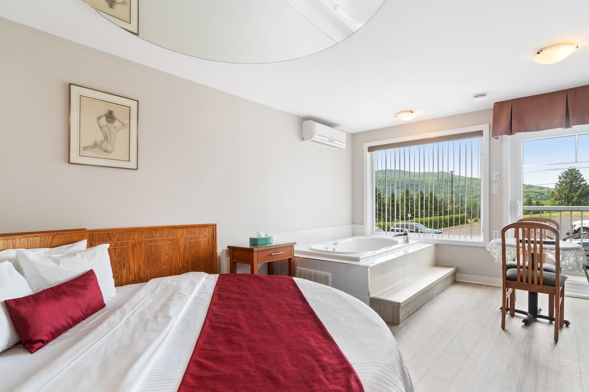 Superior King Room - King Bed with Double Whirlpool Bath and Fireplace | Egyptian cotton sheets, premium bedding, pillowtop beds, desk