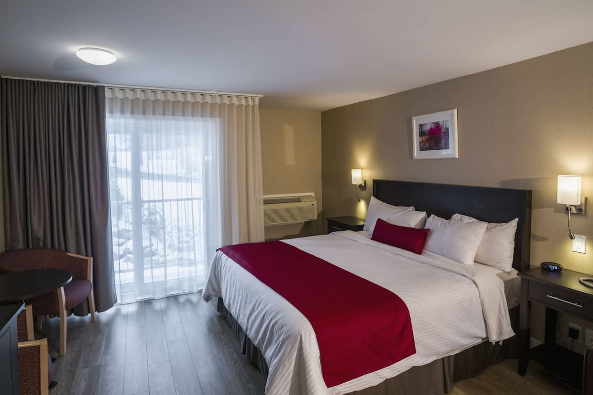 King Room - King Bed and Double-size Sofa Bed with Wood Floor | Egyptian cotton sheets, premium bedding, pillowtop beds, desk