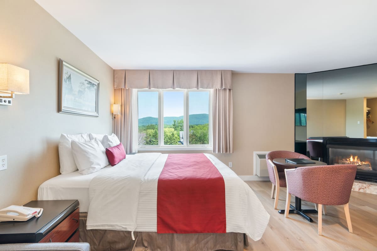 Deluxe King Room - King Bed and Sofa Bed with Double Spa Bath and Fireplace | Egyptian cotton sheets, premium bedding, pillowtop beds, desk