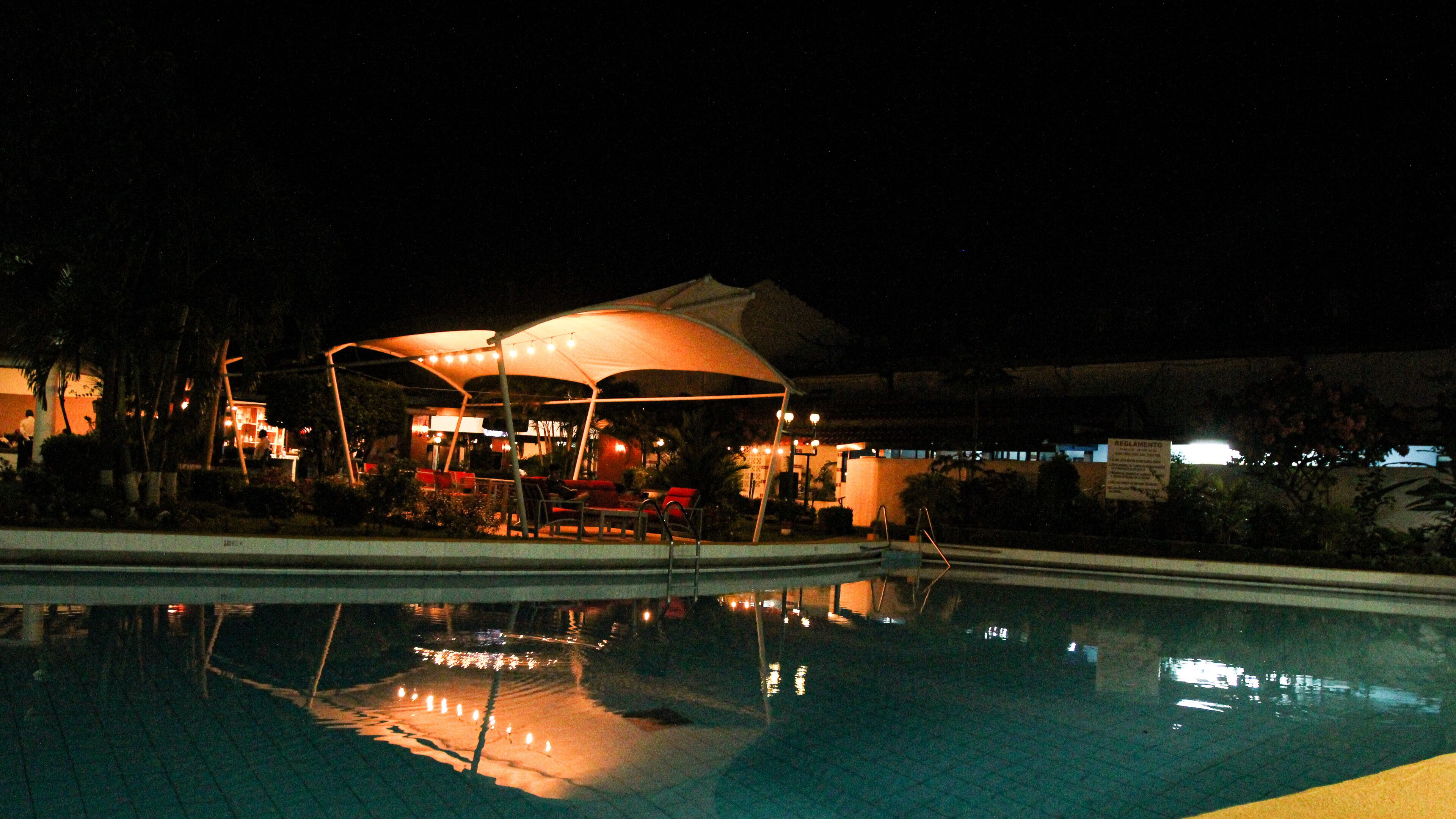 outdoor pool, open 6:00 am to 6:00 pm, pool umbrellas, pool loungers