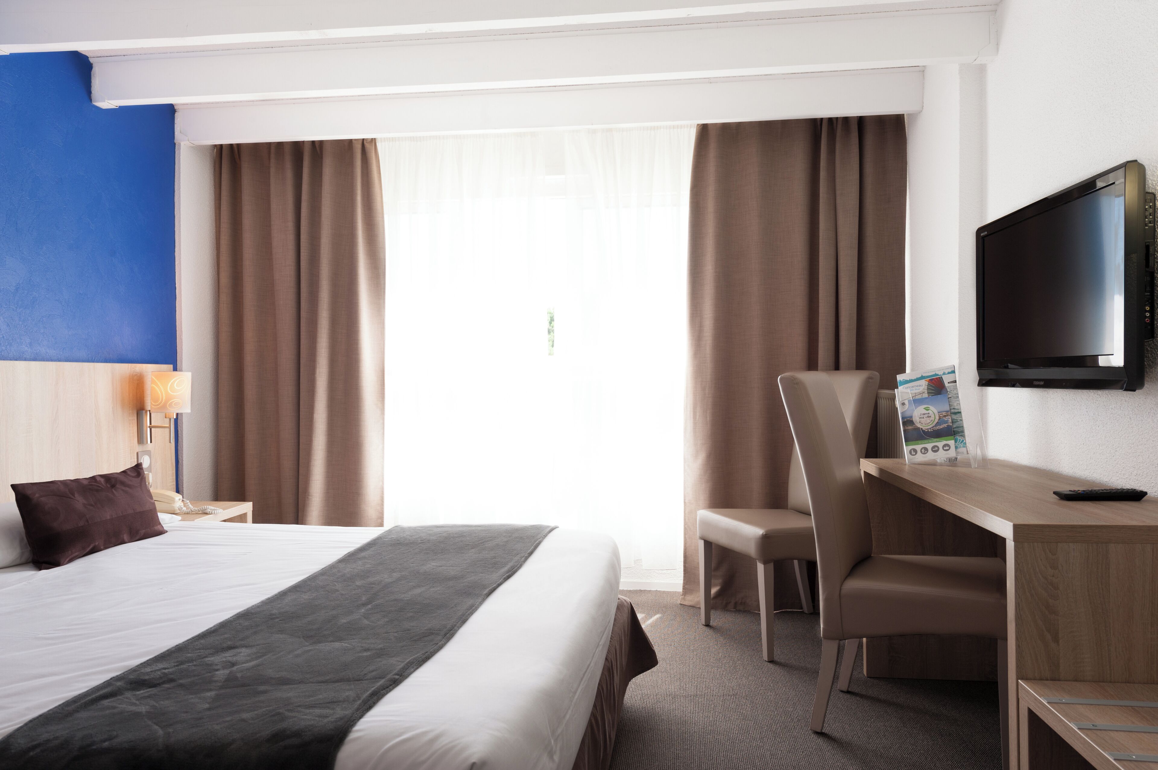 Family Room, City View (Duplex) | Desk, soundproofing, iron/ironing board, free WiFi