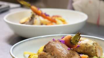 A chef preparing food in a kitchen.