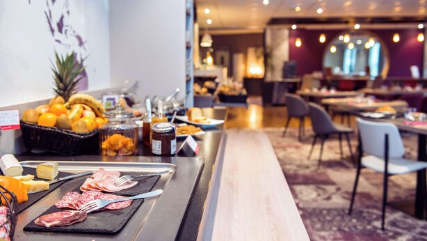 A breakfast buffet with various food items and condiments. - Brit Hotel Brest Le Relecq Kerhuon (Le Relecq-Kerhuon)