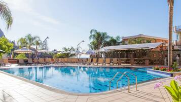 Indoor pool, pool umbrellas, pool loungers