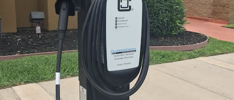 An electric vehicle charging station with a label indicating it is a high power station.