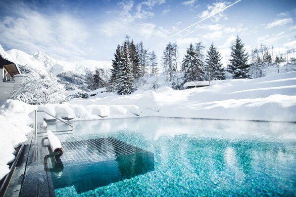 Indoor pool, outdoor pool, pool umbrellas, pool loungers