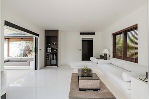 Grand Pool Suite Beachfront | Living area | LED TV, DVD player - The Racha (Ko Racha Yai)