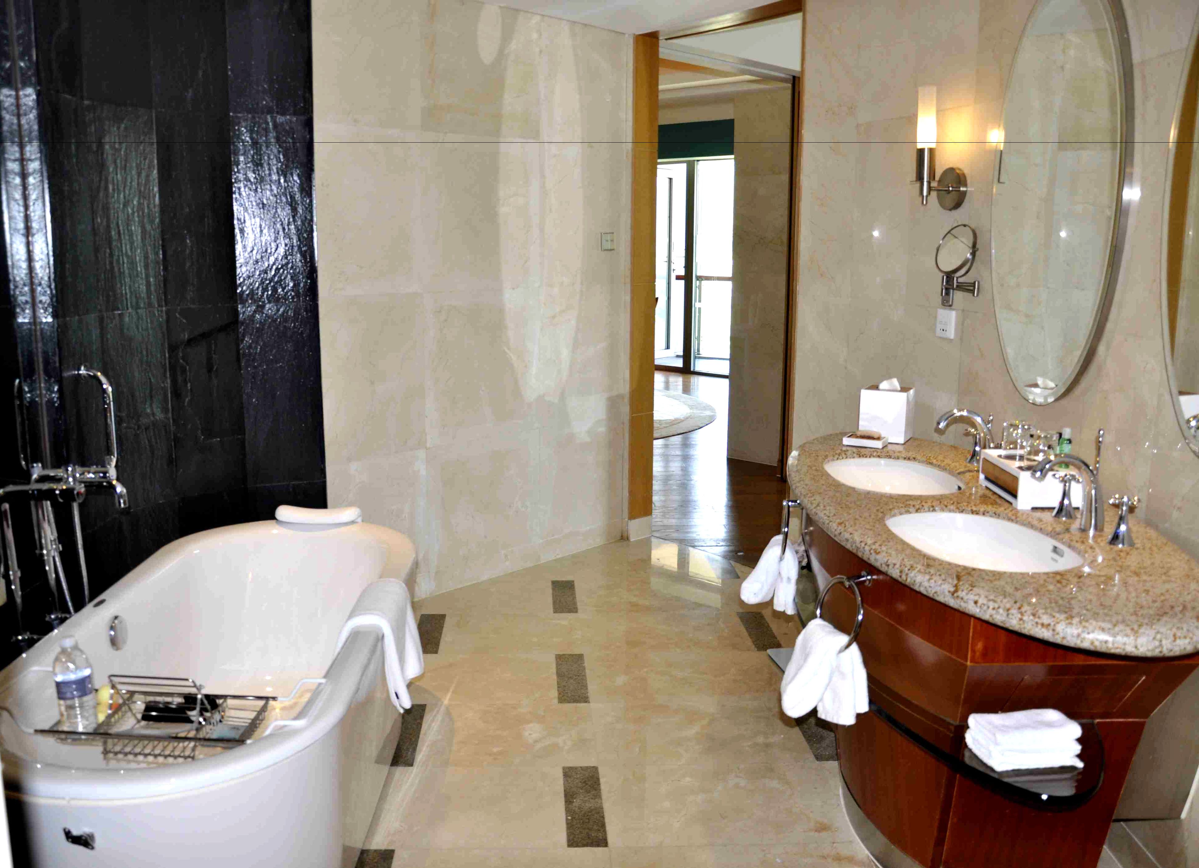 separate bathtub and shower, rainfall showerhead, designer toiletries