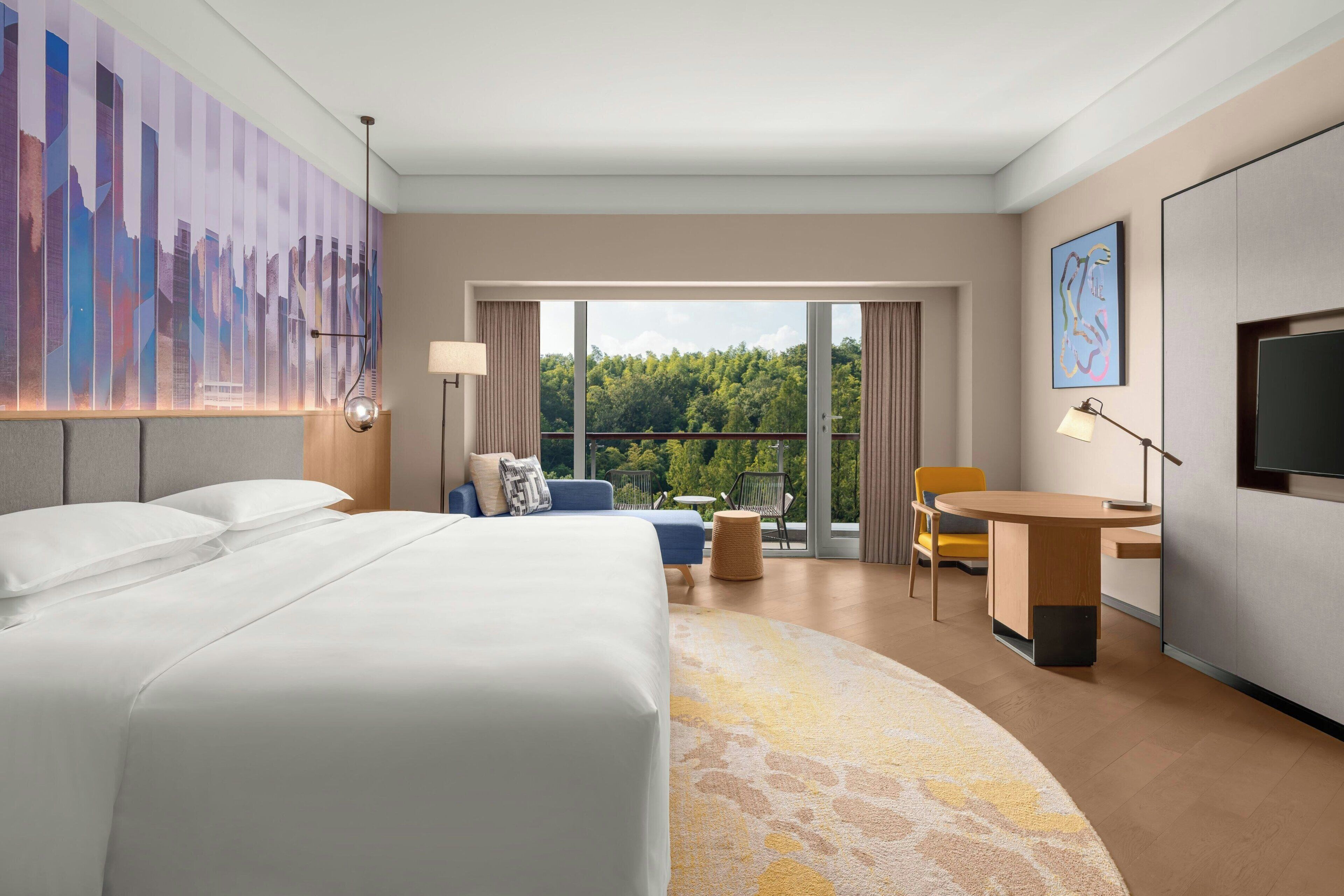 Room, 1 King Bed, Balcony, Garden View | Minibar, in-room safe, desk, blackout drapes