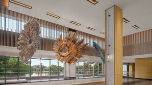 A spacious lobby with large windows, modern lighting, and abstract art installations. - Le Méridien Shanghai Sheshan (Shanghai)