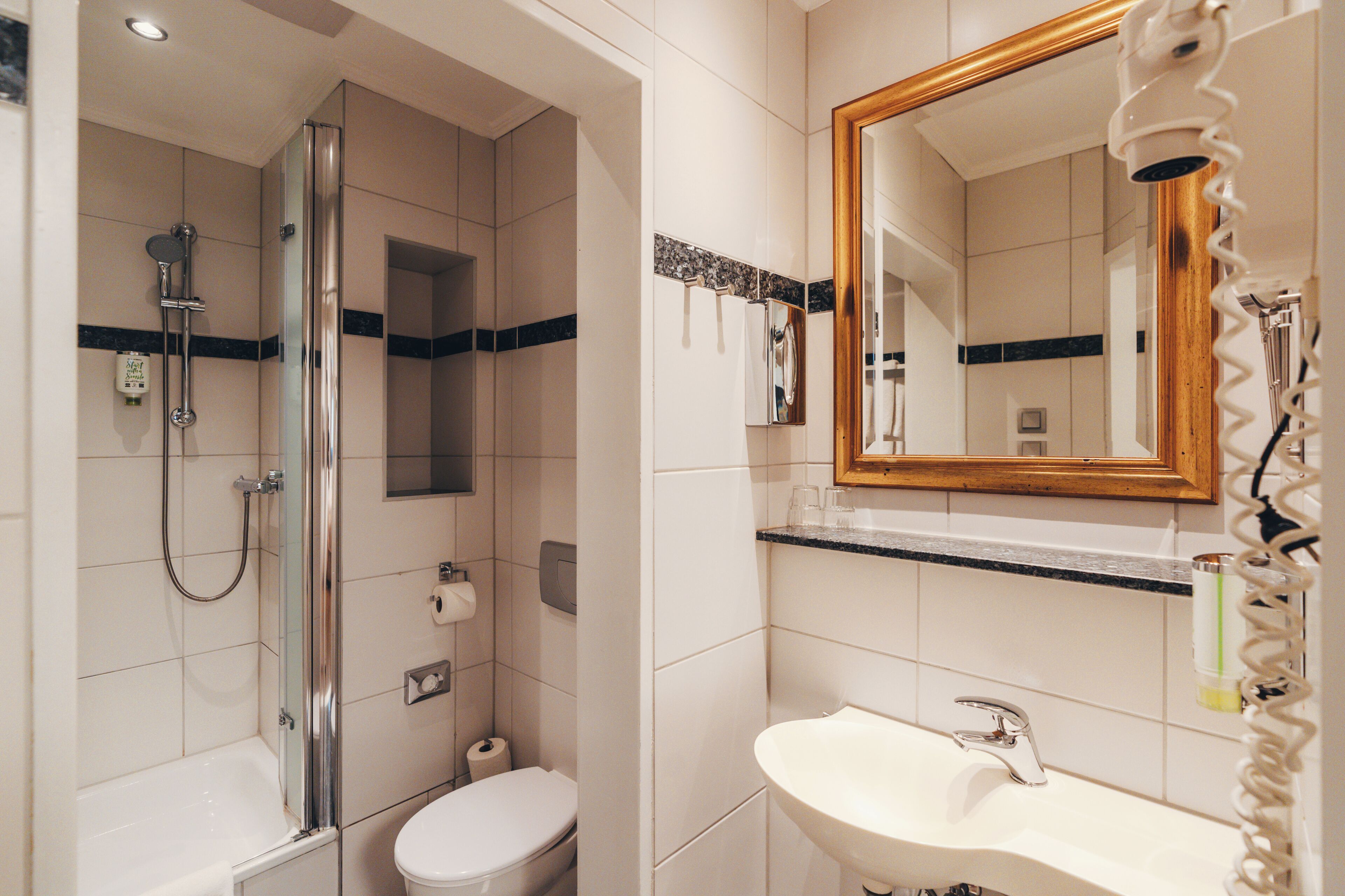 economy double room | bathroom | shower, hair dryer, towels