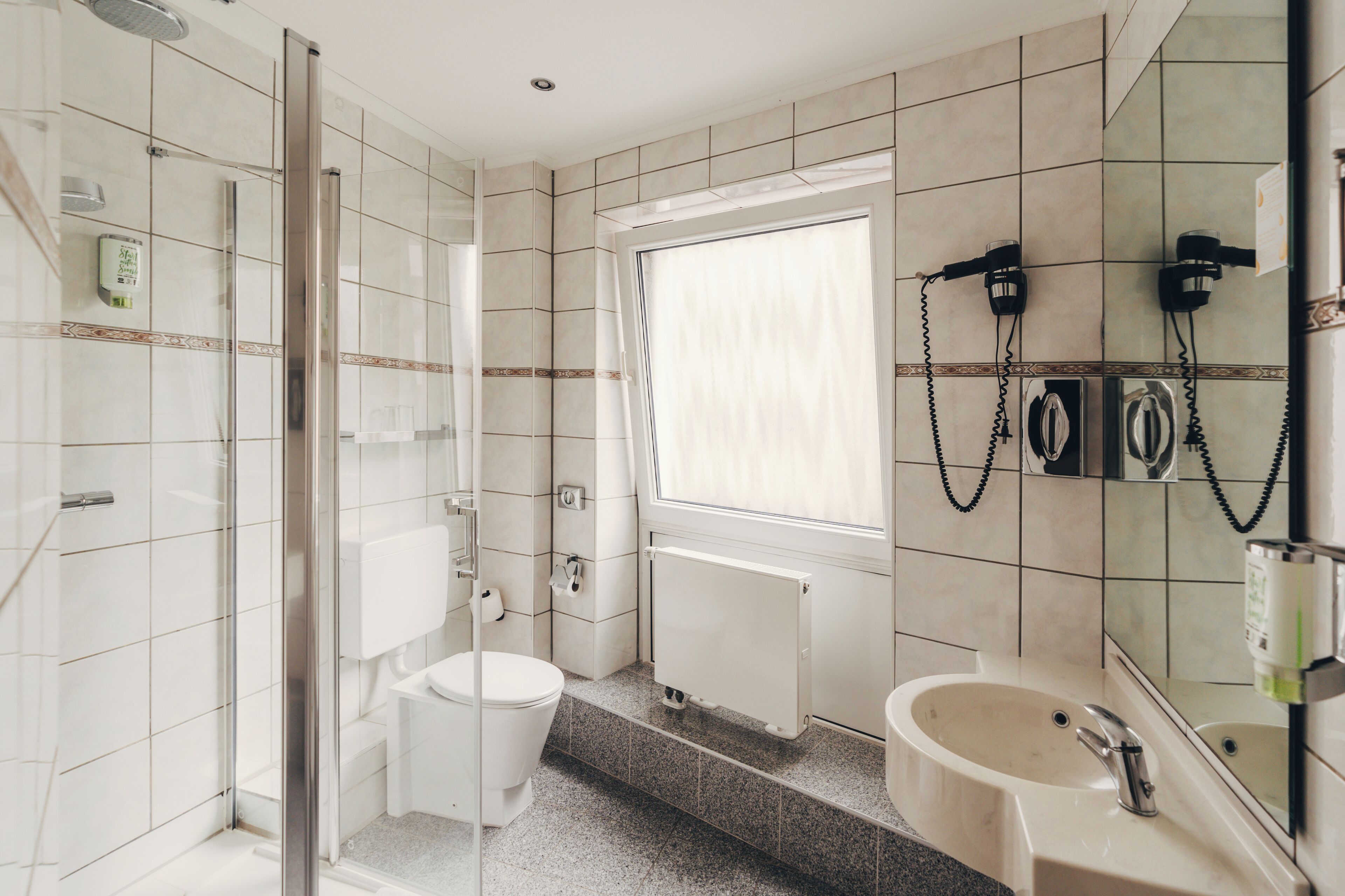 standard double room | bathroom | shower, hair dryer, towels