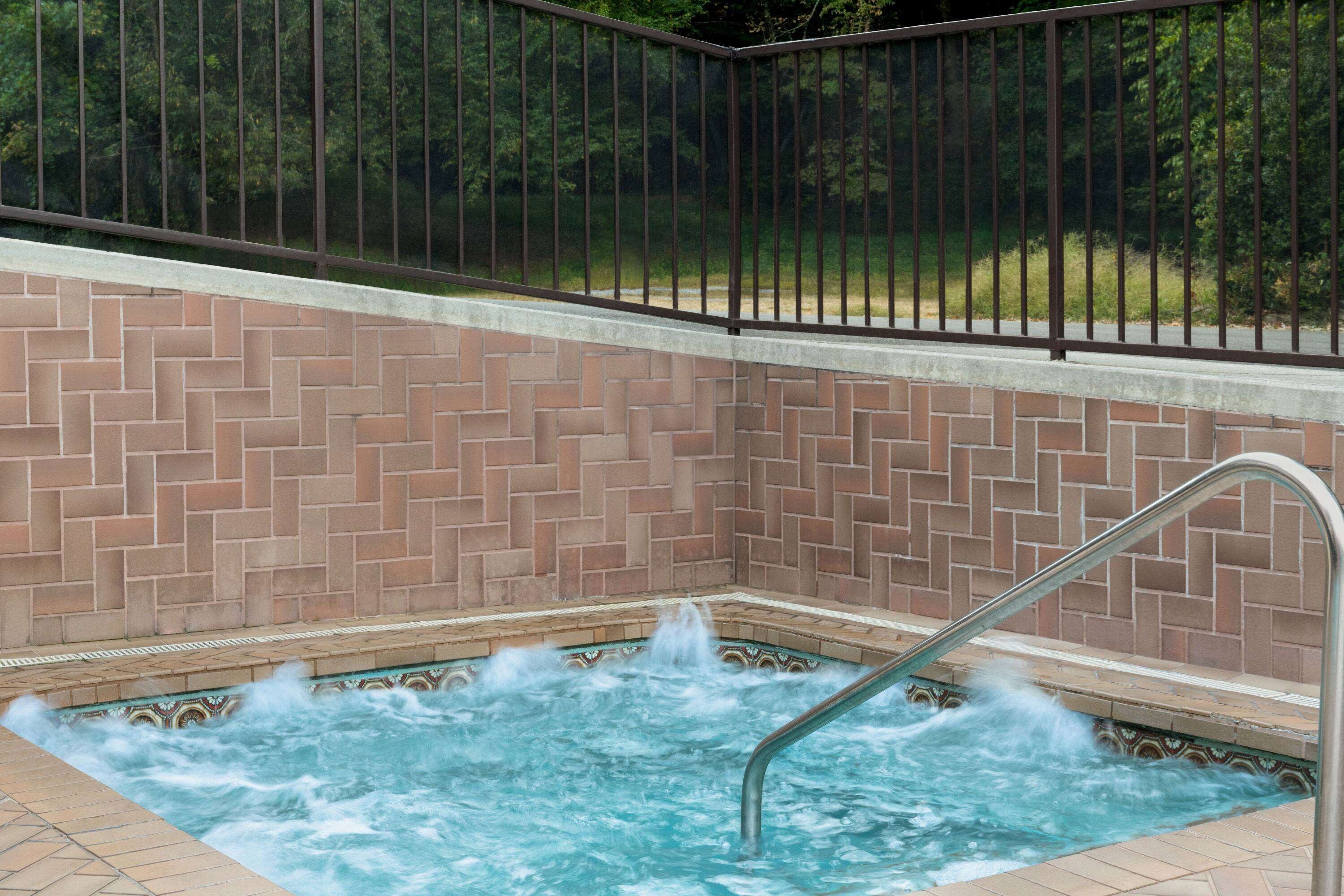 Seasonal outdoor pool, open 10:00 AM to 10:00 PM, pool umbrellas