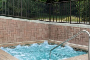 Seasonal outdoor pool, open 10:00 AM to 10:00 PM, pool umbrellas