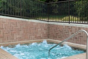 Seasonal outdoor pool, open 10:00 AM to 10:00 PM, pool umbrellas