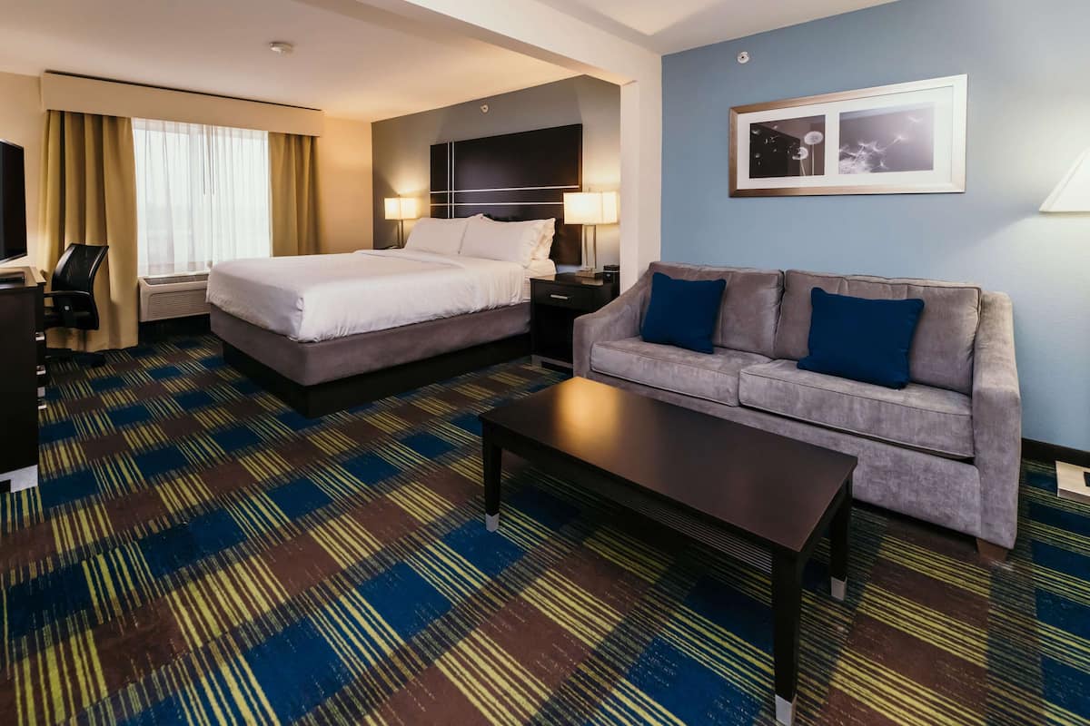 Suite, 1 King Bed with Sofa bed, Non Smoking | In-room safe, desk, laptop workspace, iron/ironing board