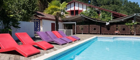 Seasonal outdoor pool, pool loungers