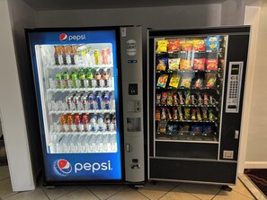 Two vending machines, one with Pepsi beverages and the other with snacks. - Admiralty Inn & Suites - a Red Collection Hotel (East Falmouth)