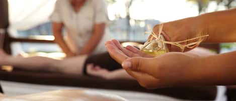 A massage therapy session with a person receiving a treatment.