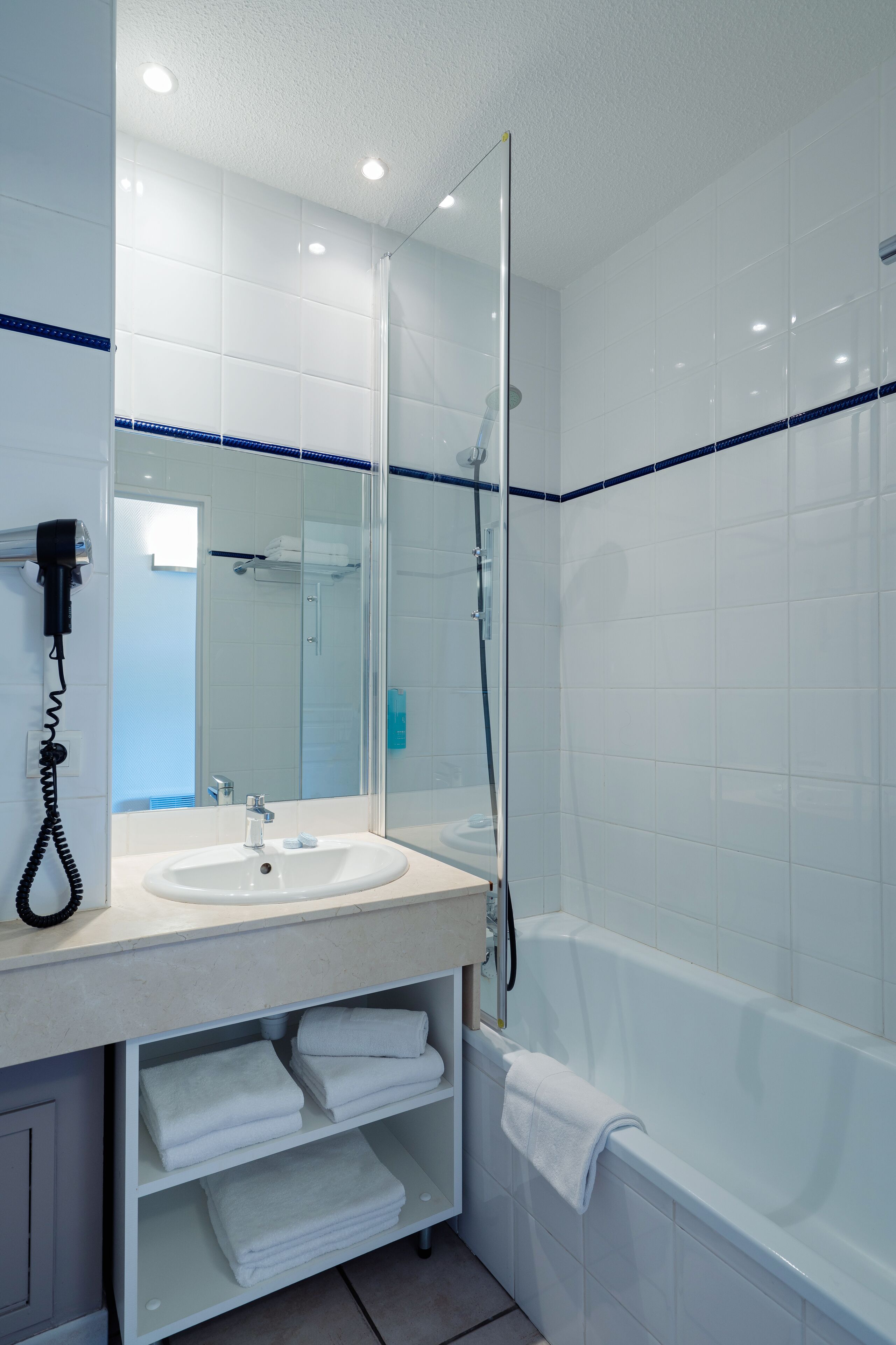 Bathtub, hair dryer, towels