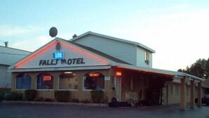 A motel with a sign reading "FALLS MOTEL" and a digital display showing "OPEN". - Blue Falls Motel (Tonawanda)