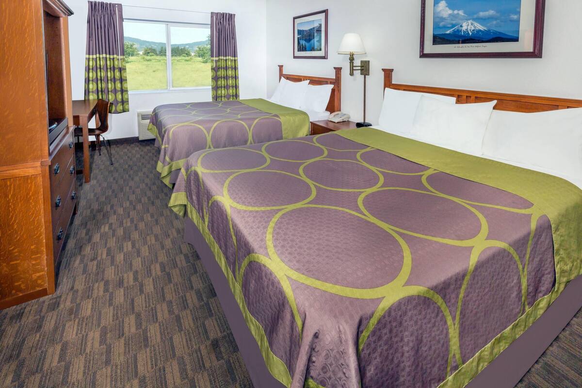 Desk, laptop workspace, iron/ironing board, free cribs/infant beds