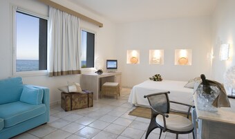 Suite, Sea View | Minibar, in-room safe, desk, laptop workspace
