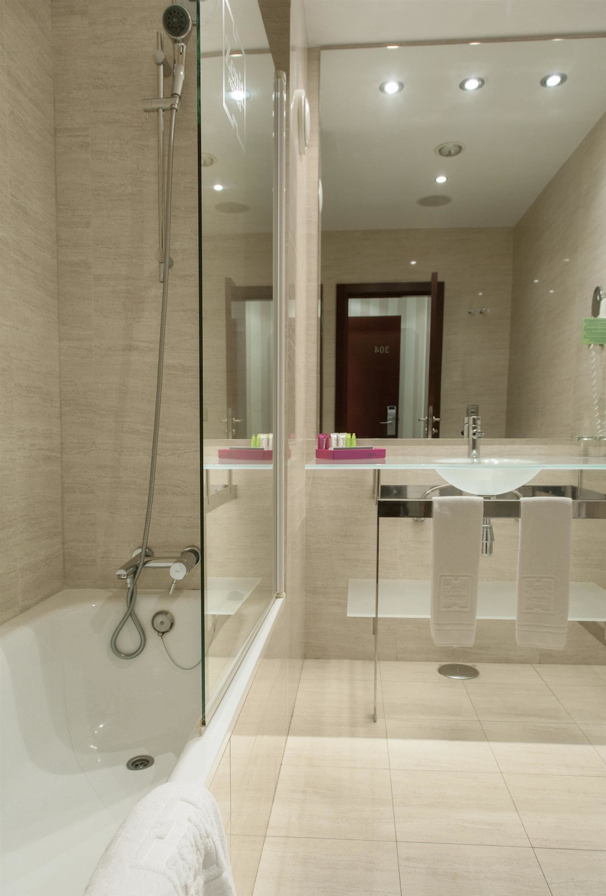 deep-soaking bathtub, rainfall showerhead, eco-friendly toiletries