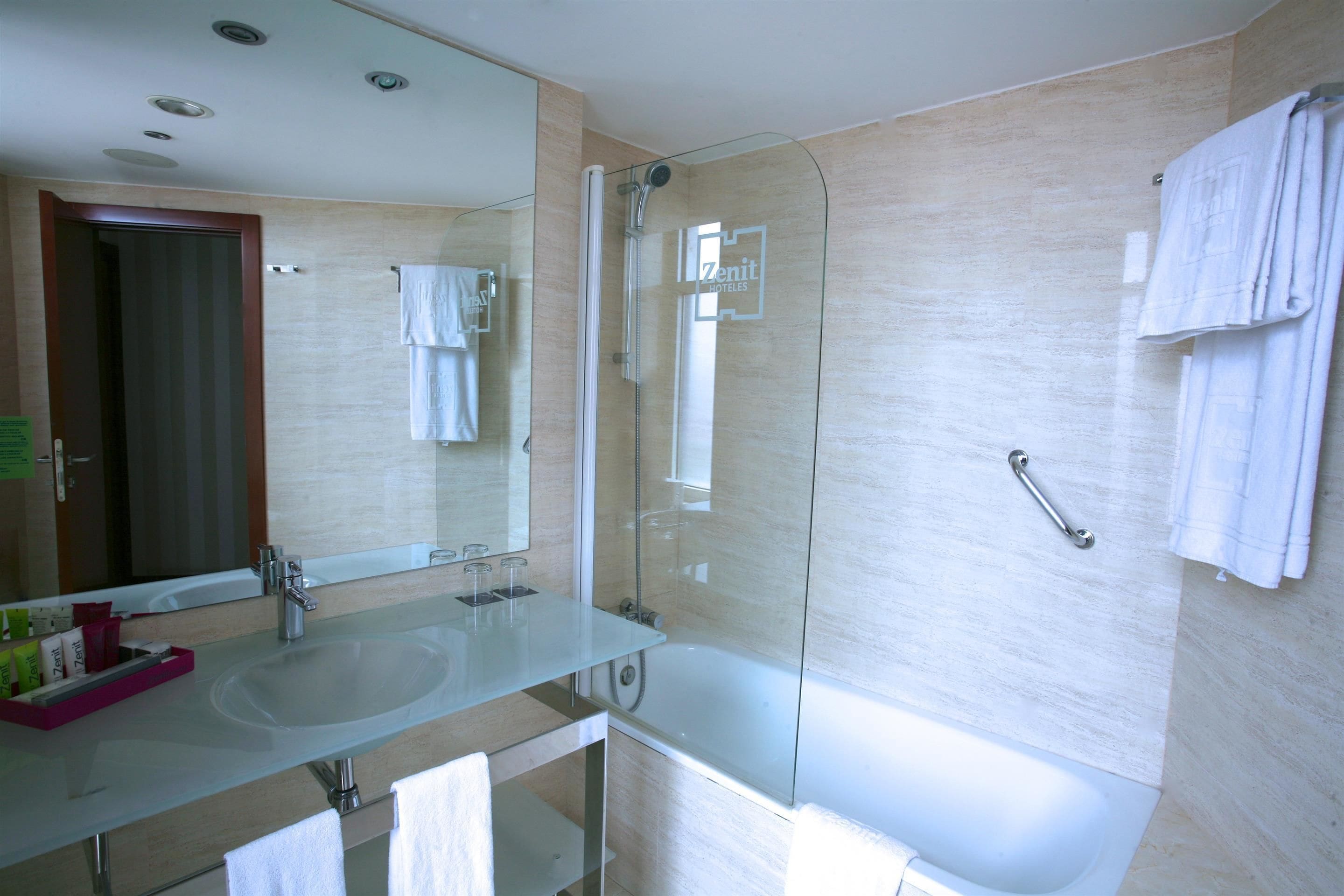 deep-soaking bathtub, rainfall showerhead, eco-friendly toiletries