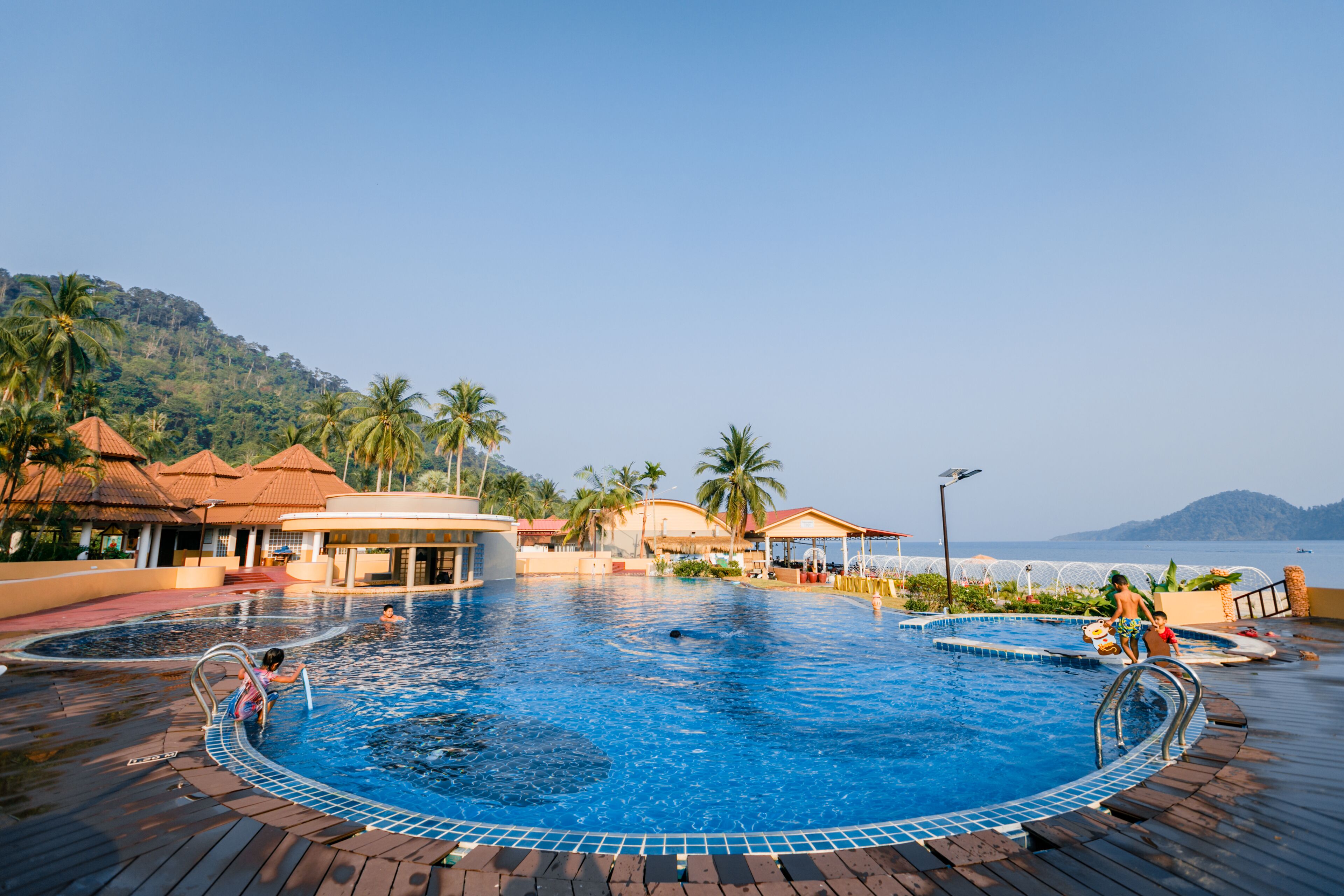 outdoor pool, pool umbrellas, pool loungers