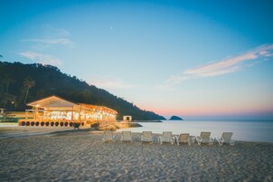 Private beach, beach umbrellas, beach towels, beach volleyball