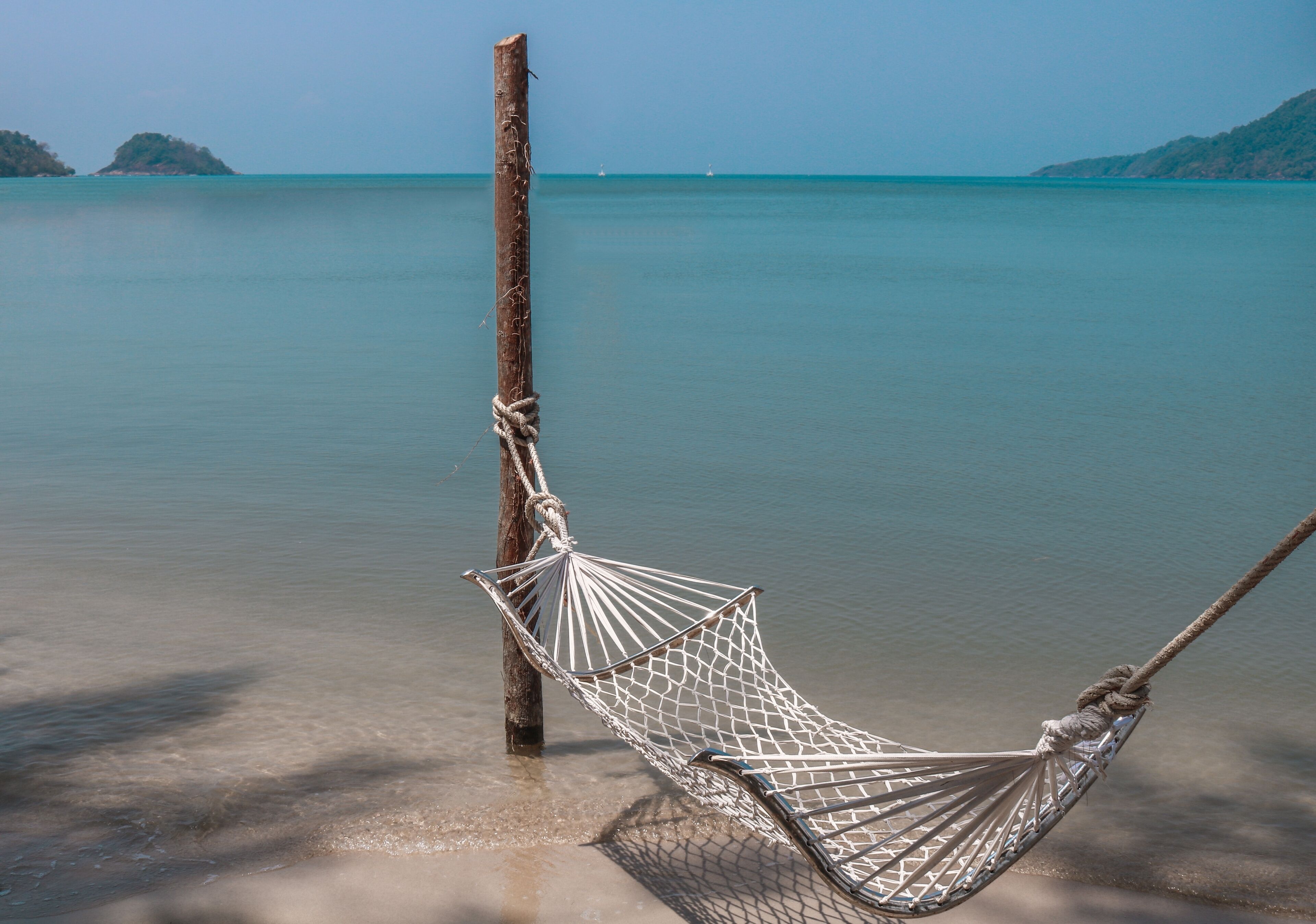 private beach, beach umbrellas, beach towels, beach volleyball