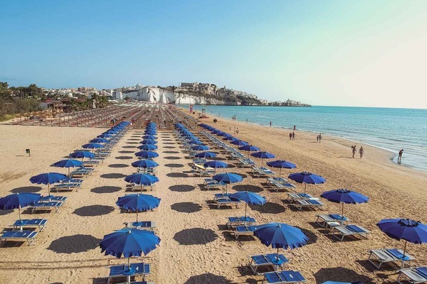 Private beach, white sand, sun loungers, beach umbrellas