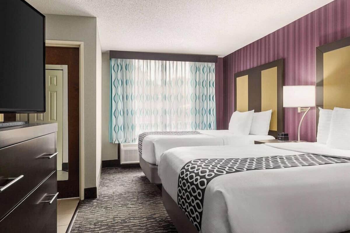 Premium bedding, pillow-top beds, desk, blackout curtains