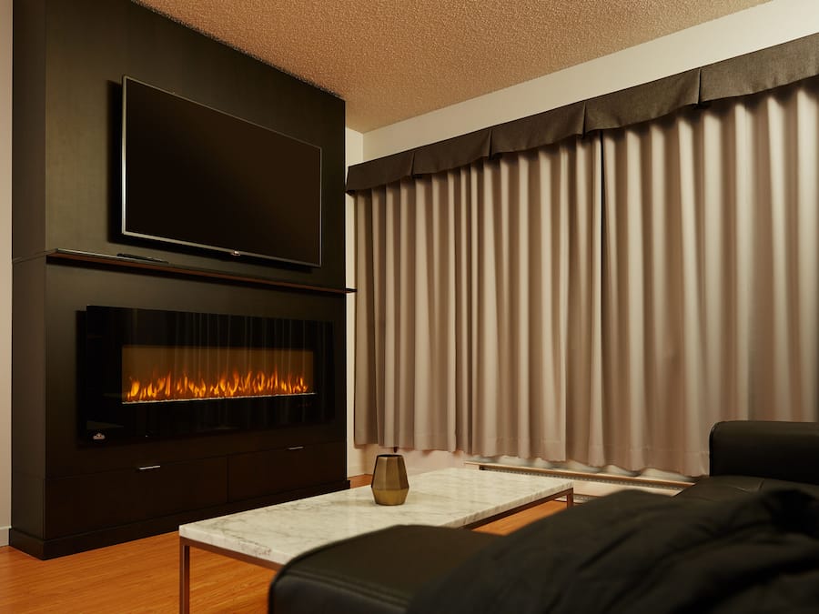 Deluxe Suite, 1 King Bed | Living area | 55-inch flat-screen TV with cable channels, TV, computer monitors