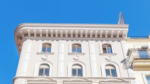 A multi-story building with a classical architectural style, featuring ornate balconies and a symmetrical facade. - Hotel Raffaello, Sure Hotel Collection by Best Western (Rome)