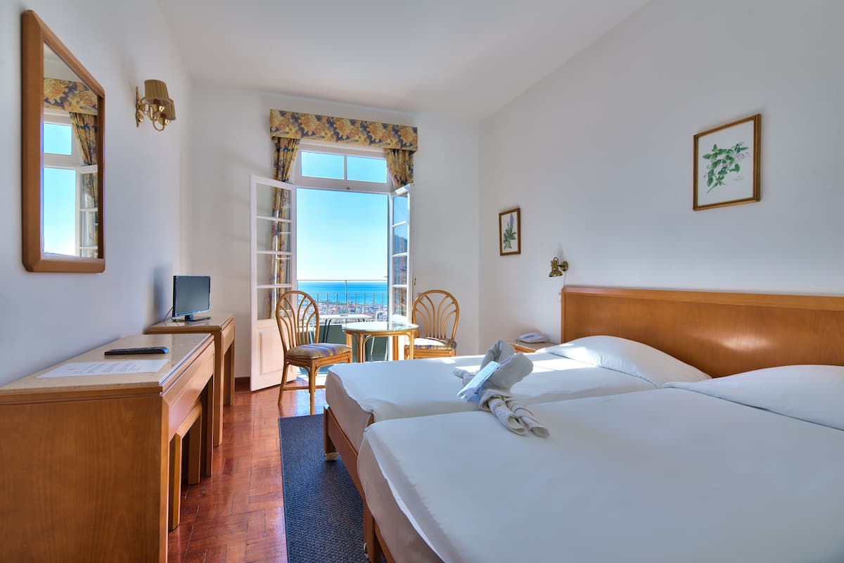 Classic Double or Twin Room, Sea View | Individually decorated, desk, free cots/infant beds, bed sheets