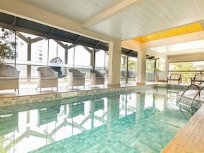 Indoor pool, open 7:00 AM to 10:00 PM, pool loungers