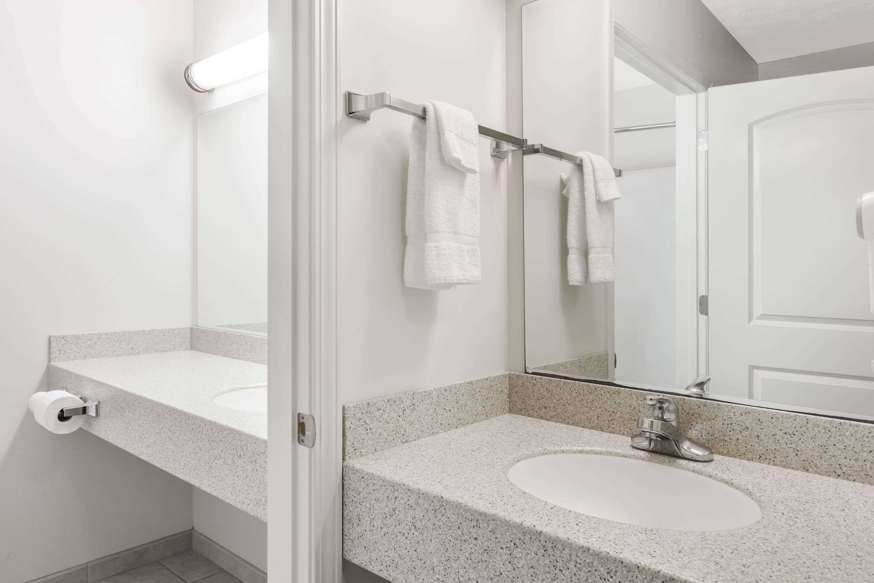 combined shower/bathtub, deep-soaking bathtub, hair dryer, towels