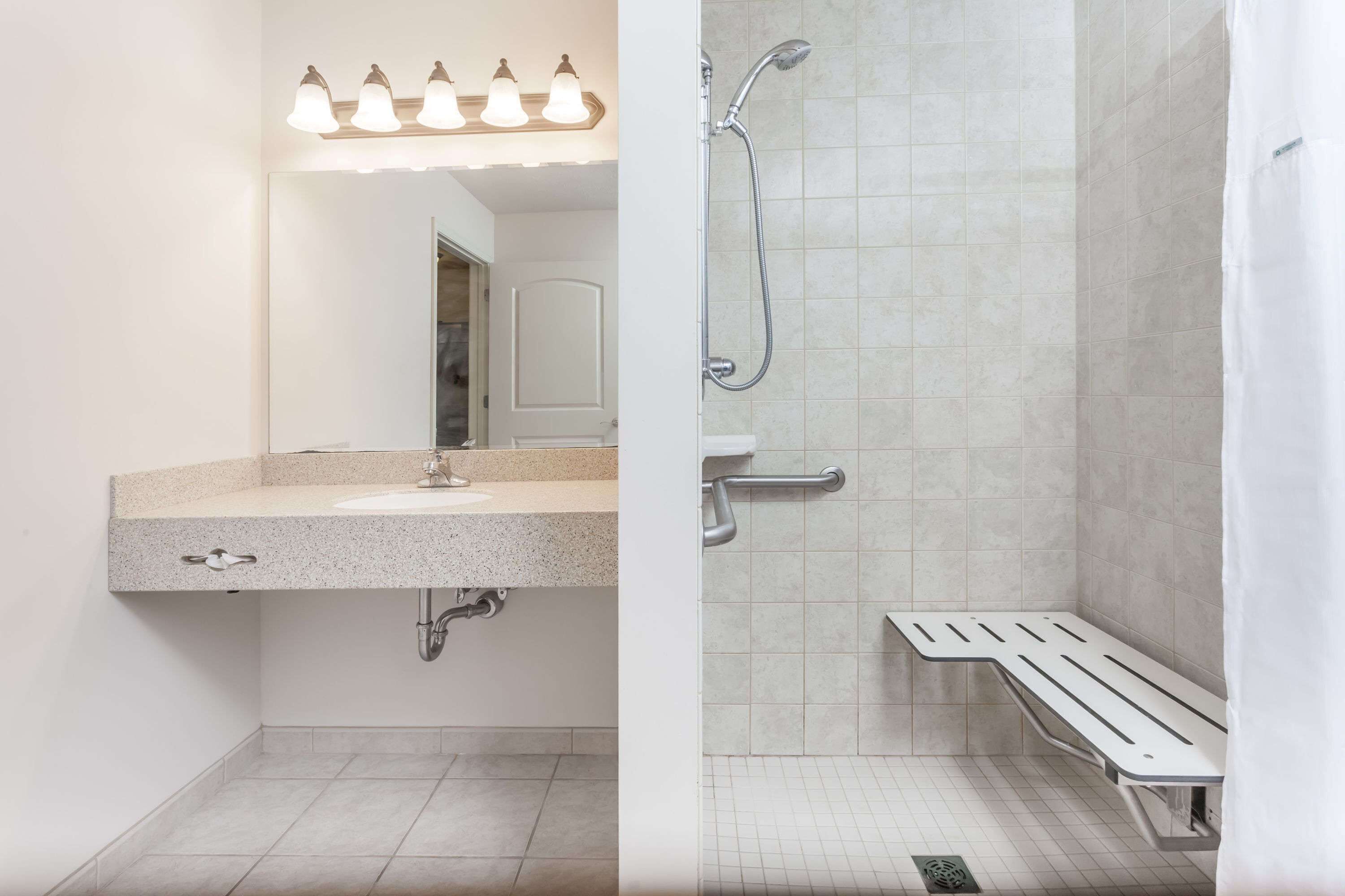 combined shower/bathtub, deep-soaking bathtub, hair dryer, towels