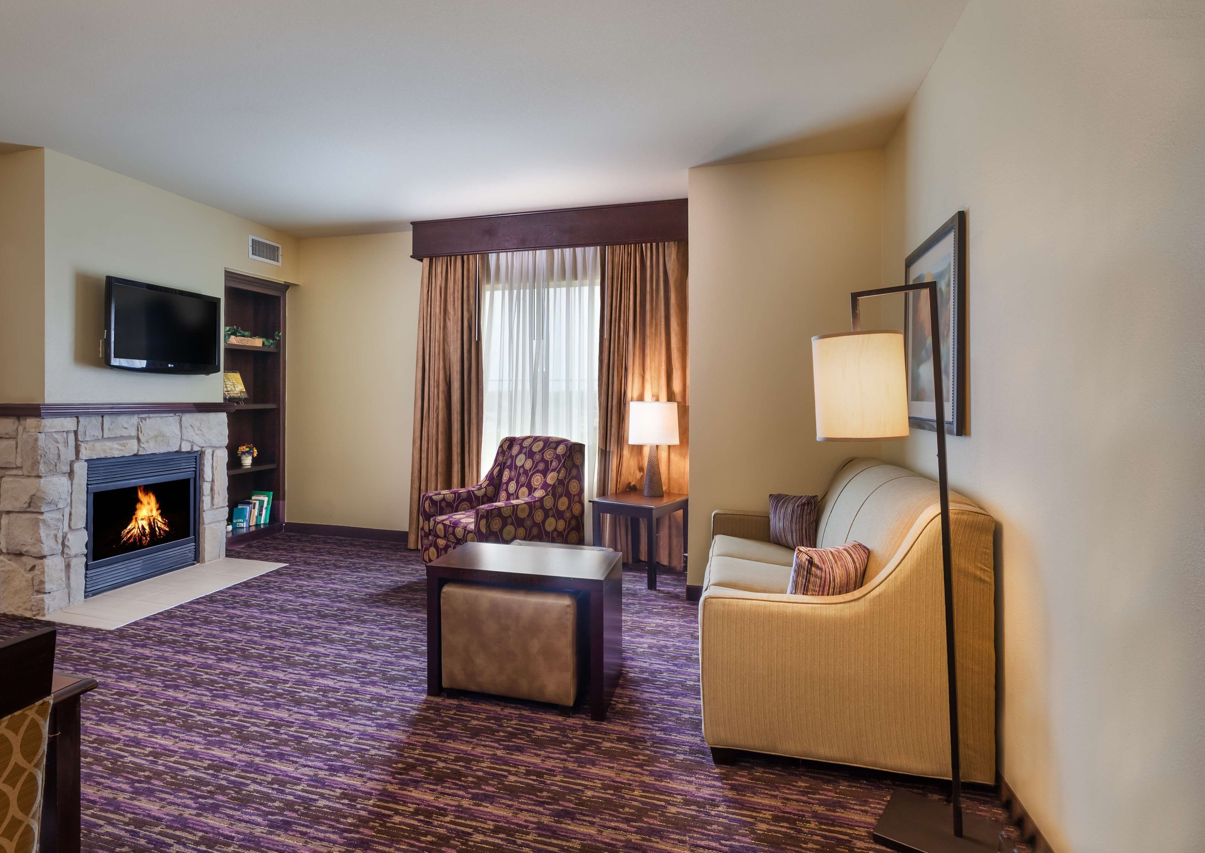 suite, 1 king bed, fireplace | in-room safe, desk, iron/ironing board, free rollaway beds